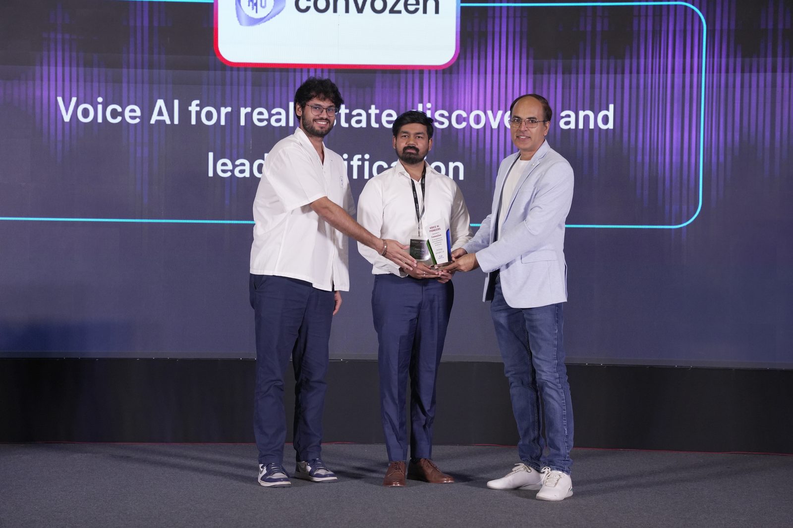 Keerthi receiving the Voice AI Pioneers award on stage